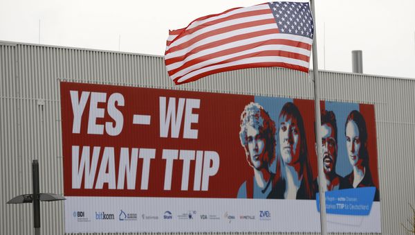 The flag of the USA flutters over a hall of the Hanover Fair decorated with a banner supporting the free trade agreement TTIP (Transatlantic Trade and Investment Partnership) in Hanover, Germany April 25, 2016 The flag of the USA flutters over a hall of the Hanover Fair decorated with a banner supporting the free trade agreement TTIP (Transatlantic Trade and Investment Partnership) in Hanover, Germany April 25, 2016 - Sputnik International