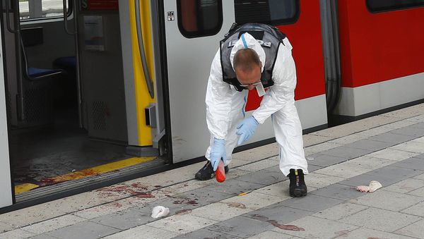 A Police officer investigates the scene of a stabbing at a station in Grafing near Munich, Germany, Tuesday, May 10, 2016 A Police officer investigates the scene of a stabbing at a station in Grafing near Munich, Germany, Tuesday, May 10, 2016 - Sputnik International