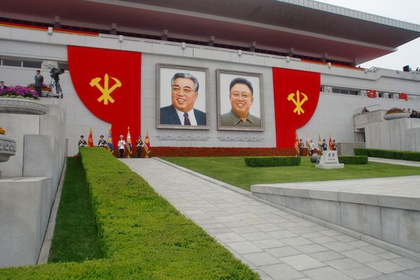 Portraits of North Korean leaders are seen as the parade goes on Portraits of North Korean leaders are seen as the parade goes on - Sputnik International