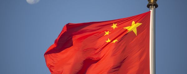 The moon sets above a Chinese flag flying over Tiananmen Square after a flag raising ceremony on National Day, the 66th anniversary of the founding of the People's Republic of China, in Beijing, Thursday, Oct. 1, 2015 The moon sets above a Chinese flag flying over Tiananmen Square after a flag raising ceremony on National Day, the 66th anniversary of the founding of the People's Republic of China, in Beijing, Thursday, Oct. 1, 2015 - Sputnik International