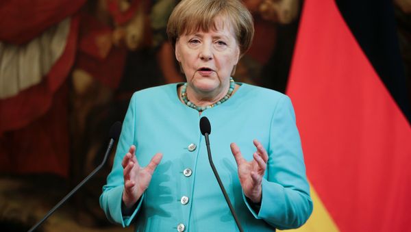German Chancellor Angela Merkel speaks next to Italian Prime Minister Matteo Renzi (not seen) during a news conference at Chigi Palace in Rome, Italy May 5, 2016. - Sputnik International
