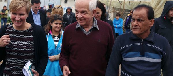 Canadian Minister of Immigration John McCallum, center, walks during his visit to a Syrian refugee camp. Canadian Minister of Immigration John McCallum, center, walks during his visit to a Syrian refugee camp. - Sputnik International