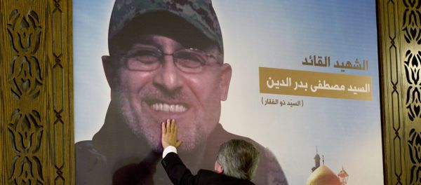 Adnan Badreddine, brother of top Hezbollah commander Mustafa Badreddine, grieves at his brother's picture in a southern suburb of Beirut, Lebanon Adnan Badreddine, brother of top Hezbollah commander Mustafa Badreddine, grieves at his brother's picture in a southern suburb of Beirut, Lebanon - Sputnik International
