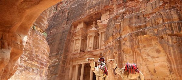 A Jordanian Bedouin sits on a camel in front of the Treasury Building in the ancient city of Petra in Jordan on May 9, 2016 A Jordanian Bedouin sits on a camel in front of the Treasury Building in the ancient city of Petra in Jordan on May 9, 2016 - Sputnik International