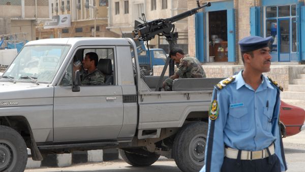 Yemeni policemen stand guard in the Yemeni city of Mukalla - Sputnik International