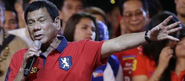 Philippine presidential race front-runner Davao city mayor Rodrigo Duterte gestures during his final campaign rally in Manila, Philippines on Saturday, May 7, 2016. - Sputnik International