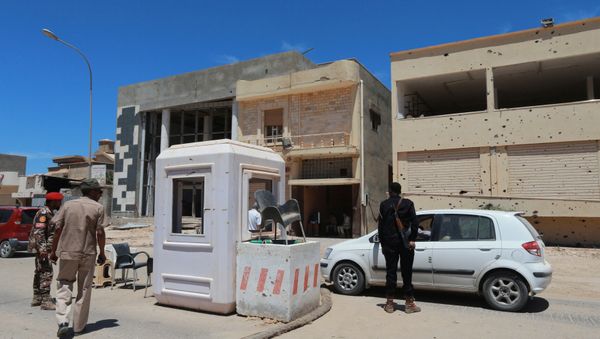 Members for the Libyan Armed Forces stand at a checkpoint in Benghazi, Libya May 16, 2016 Members for the Libyan Armed Forces stand at a checkpoint in Benghazi, Libya May 16, 2016 - Sputnik International