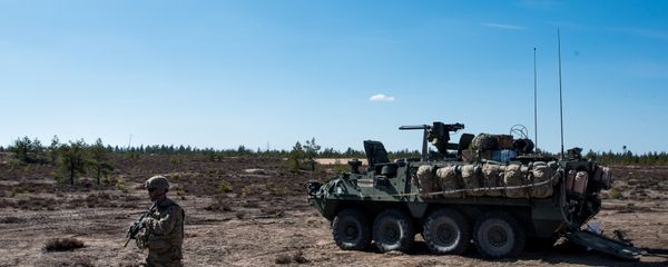 US army soldier and Stryker armored vehicle during Arrow 16 mechanised exercise of the Finnish Army in collaboration with US Army Europe's 2nd Cavalry Regiment's Mechanized Infantry Company in Niinisalo, Finland (File) - Sputnik International