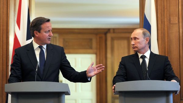 British Prime Minister David Cameron (L) speaks during a press conference with Russian President Vladimir Putin following a meeting inside10 Downing Street, central London, on June 16, 2013. British Prime Minister David Cameron (L) speaks during a press conference with Russian President Vladimir Putin following a meeting inside10 Downing Street, central London, on June 16, 2013. - Sputnik International