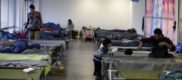 Migrants rest at the Hellenikon shelter in southern Athens en route to northern Europe Migrants rest at the Hellenikon shelter in southern Athens en route to northern Europe - Sputnik International
