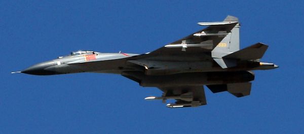 The latest Chinese Jian-series fighter jet executes a fly-by over Beijing on September 12, 2009 during a rehearsal for National Day The latest Chinese Jian-series fighter jet executes a fly-by over Beijing on September 12, 2009 during a rehearsal for National Day - Sputnik International