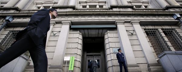 In this Nov. 19, 2014 file photo, a man walks by the Bank of Japan headquarters in Tokyo - Sputnik International