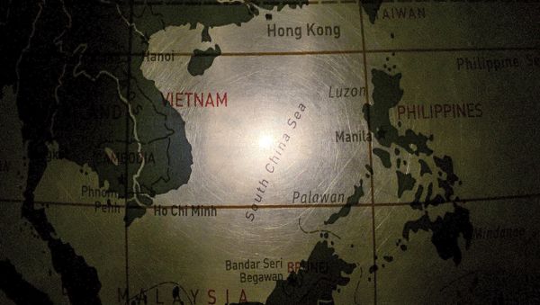 In this May 1, 2016, photo, an illuminated globe shows the South China Sea at a museum in Pathumthani, Thailand - Sputnik International
