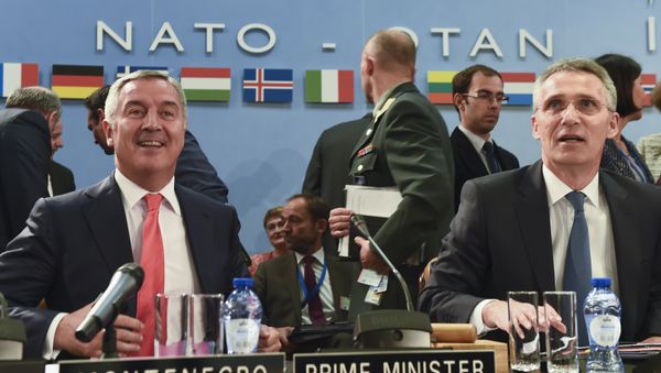 Montenegro's Prime Minister Milo Dukanovic (L) attends a NATO Foreign minister meeting next to NATO Secretary General Jens Stoltenberg (R) at the NATO headquarters in Brussels on May 19, 2016 Montenegro's Prime Minister Milo Dukanovic (L) attends a NATO Foreign minister meeting next to NATO Secretary General Jens Stoltenberg (R) at the NATO headquarters in Brussels on May 19, 2016 - Sputnik International