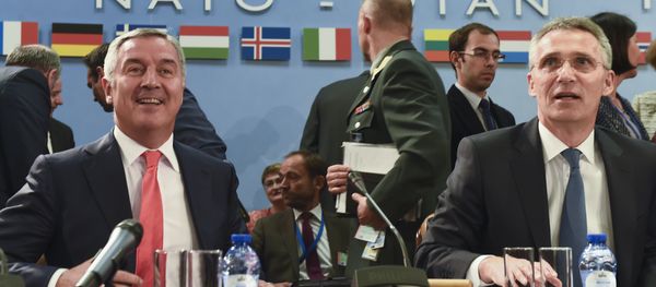 Montenegro's Prime Minister Milo Dukanovic (L) attends a NATO Foreign minister meeting next to NATO Secretary General Jens Stoltenberg (R) at the NATO headquarters in Brussels on May 19, 2016 - Sputnik International