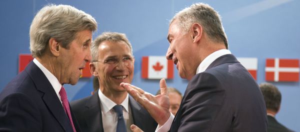 Montenegro's Prime Minister Milo Dukanovic, right, speaks with U.S. Secretary of State John Kerry, left, and NATO Secretary General Jens Stoltenberg, center, during a meeting of the North Atlantic Council at NATO headquarters in Brussels on Thursday, May 19, 2016 Montenegro's Prime Minister Milo Dukanovic, right, speaks with U.S. Secretary of State John Kerry, left, and NATO Secretary General Jens Stoltenberg, center, during a meeting of the North Atlantic Council at NATO headquarters in Brussels on Thursday, May 19, 2016 - Sputnik International