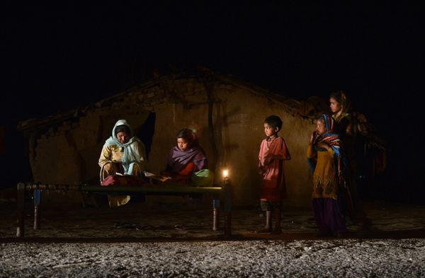 An Indian girl (C) studies by candle light in a slum area without electric power in Phillaur An Indian girl (C) studies by candle light in a slum area without electric power in Phillaur - Sputnik International