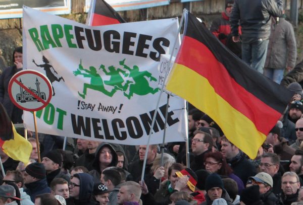 Right-wing demonstrators hold a sign Rapefugees not welcome - !Stay away! and a sign with a crossed out mosque as they march in Cologne, Germany Right-wing demonstrators hold a sign Rapefugees not welcome - !Stay away! and a sign with a crossed out mosque as they march in Cologne, Germany - Sputnik International