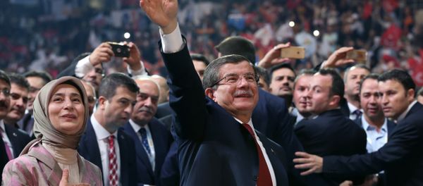Head of the governing Justice and Development Party and Prime Minister Ahmet Davutoglu with his wife Sare Davutoglu, left, waves towards supporters during the party congress in Ankara, Turkey, Sunday, May 22, 2016. Head of the governing Justice and Development Party and Prime Minister Ahmet Davutoglu with his wife Sare Davutoglu, left, waves towards supporters during the party congress in Ankara, Turkey, Sunday, May 22, 2016. - Sputnik International