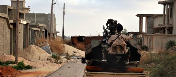 Man loyal to the Libyan armed forces prepares himself for clashes with Islamic State group militants in Libya. (File) Man loyal to the Libyan armed forces prepares himself for clashes with Islamic State group militants in Libya. (File) - Sputnik International