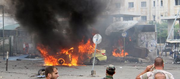 A Syrian army soldier and civilians inspect the damage after explosions hit the Syrian city of Tartous, in this handout picture provided by SANA on May 23, 2016. - Sputnik International