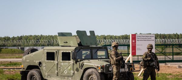 Soldiers stand guard during ground breaking ceremony of the northern section of defence anti-missile shield in Redzikowo military base in northern Poland - Sputnik International