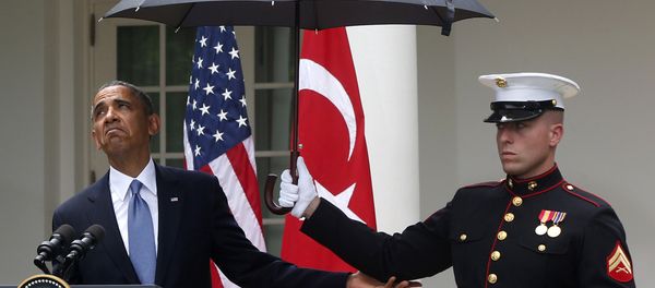 President Barack Obama looks to see if it is still raining as a Marine holds an umbrella for him during his joint news conference with Turkish President Tayyip Erdogan (File) President Barack Obama looks to see if it is still raining as a Marine holds an umbrella for him during his joint news conference with Turkish President Tayyip Erdogan (File) - Sputnik International