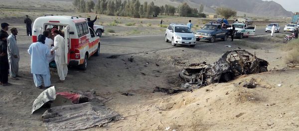 This photo taken by freelance photographer Abdul Malik on Saturday, May 21, 2016, purports to show volunteers standing near the wreckage of the destroyed vehicle, in which Mullah Mohammad Akhtar Mansour was allegedly traveling in the Ahmed Wal area in Baluchistan province of Pakistan, near Afghanistan border This photo taken by freelance photographer Abdul Malik on Saturday, May 21, 2016, purports to show volunteers standing near the wreckage of the destroyed vehicle, in which Mullah Mohammad Akhtar Mansour was allegedly traveling in the Ahmed Wal area in Baluchistan province of Pakistan, near Afghanistan border - Sputnik International