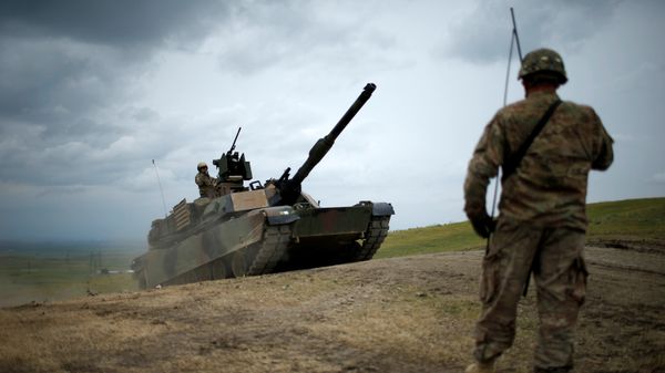 U.S. M1A2 Abrams tank moves to firing positions during U.S. led joint military exercise Noble Partner 2016 near Vaziani, Georgia, May 18, 2016 U.S. M1A2 Abrams tank moves to firing positions during U.S. led joint military exercise Noble Partner 2016 near Vaziani, Georgia, May 18, 2016 - Sputnik International