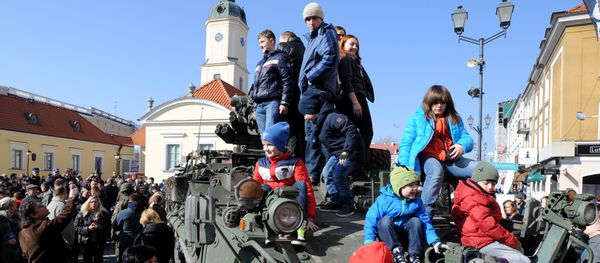 People surround a group of US Army Stryker armored vehicles from the 3rd Squadron of the 2nd Cavalry Regiment, during a stop on the Kosciuszko Market Square to meet residents, in Bialystok, Poland (File) People surround a group of US Army Stryker armored vehicles from the 3rd Squadron of the 2nd Cavalry Regiment, during a stop on the Kosciuszko Market Square to meet residents, in Bialystok, Poland (File) - Sputnik International