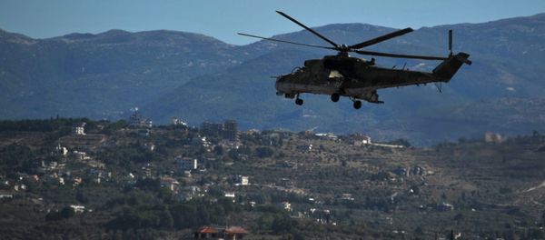 A Mi-24 helicopter of the Russian Aerospace Forces circles around the territory of Hemeimeem air base in Syria. A Mi-24 helicopter of the Russian Aerospace Forces circles around the territory of Hemeimeem air base in Syria. - Sputnik International