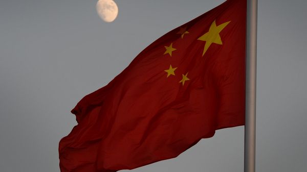 The Chinese flag is seen in front of a view of the moon at Tiananmen Square in Beijing on December 13, 2013 The Chinese flag is seen in front of a view of the moon at Tiananmen Square in Beijing on December 13, 2013 - Sputnik International