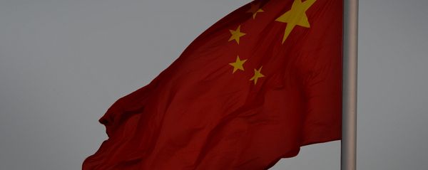 The Chinese flag is seen in front of a view of the moon at Tiananmen Square in Beijing on December 13, 2013 - Sputnik International