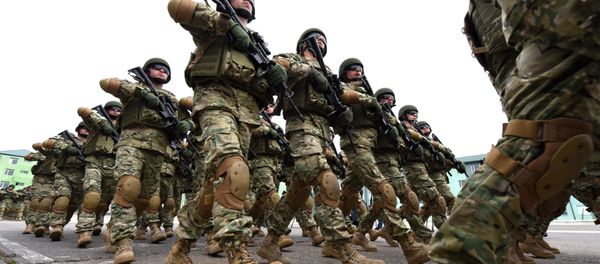 Georgian soldiers march during a farewell ceremony at the Vaziani military base outside Tbilisi, on March 24, 2016 Georgian soldiers march during a farewell ceremony at the Vaziani military base outside Tbilisi, on March 24, 2016 - Sputnik International