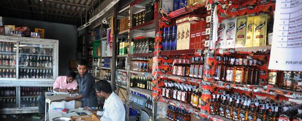 An Indian employee writes down stock at an alcohol store in Hyderabad on February 28, 2013 An Indian employee writes down stock at an alcohol store in Hyderabad on February 28, 2013 - Sputnik International