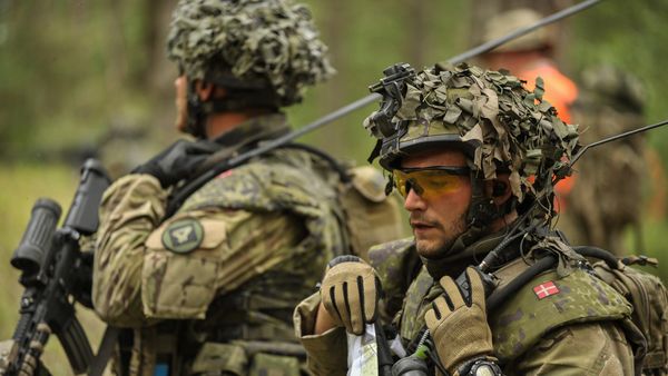 A soldier of the Royal Danish Army talks on the radio A soldier of the Royal Danish Army talks on the radio - Sputnik International