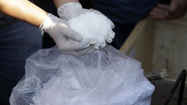 A female member of a Chinese drug gang did not think twice before using an online messaging app in order to ask for information on how to make methamphetamine - Sputnik International