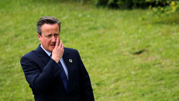 British Prime Minister David Cameron walks as he arrives at a family photo with other world leaders during the last day of the Group of Seven (G7) summit meetings in Ise Shima, Japan May 27, 2016 - Sputnik International