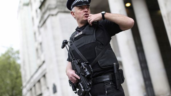 An armed police officer speaks on his radio as he patrols near the Ministry of Defence in London, Britain May 11, 2016 An armed police officer speaks on his radio as he patrols near the Ministry of Defence in London, Britain May 11, 2016 - Sputnik International