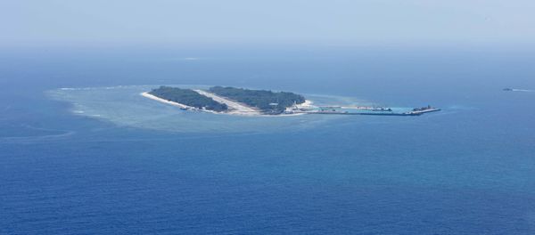 An aerial photo taken though a glass window of a Taiwanese military plane shows the view of Itu Aba, which the Taiwanese call Taiping, at the South China Sea, March 23, 2016 An aerial photo taken though a glass window of a Taiwanese military plane shows the view of Itu Aba, which the Taiwanese call Taiping, at the South China Sea, March 23, 2016 - Sputnik International