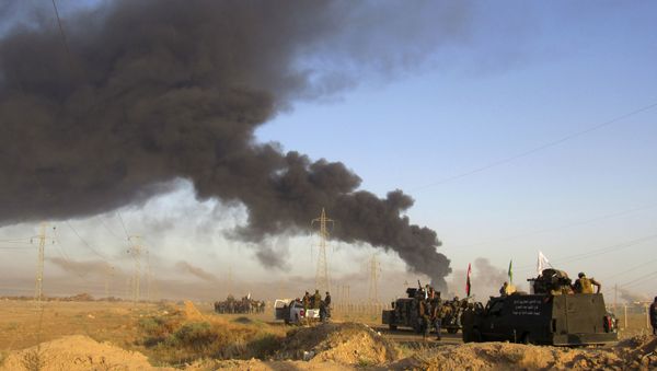 Smoke rises from Islamic State group positions after an airstrike by U.S.-led coalition warplanes in Fallujah, as Iraqi security forces and allied Shiite Popular Mobilization Forces and Sunni tribal fighters, take combat positions outside Fallujah, 40 miles (65 kilometers) west of Baghdad, Iraq, Monday, May 23, 2016 Smoke rises from Islamic State group positions after an airstrike by U.S.-led coalition warplanes in Fallujah, as Iraqi security forces and allied Shiite Popular Mobilization Forces and Sunni tribal fighters, take combat positions outside Fallujah, 40 miles (65 kilometers) west of Baghdad, Iraq, Monday, May 23, 2016 - Sputnik International