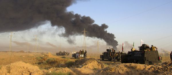 Smoke rises from Islamic State group positions after an airstrike by U.S.-led coalition warplanes in Fallujah, as Iraqi security forces and allied Shiite Popular Mobilization Forces and Sunni tribal fighters, take combat positions outside Fallujah, 40 miles (65 kilometers) west of Baghdad, Iraq, Monday, May 23, 2016 Smoke rises from Islamic State group positions after an airstrike by U.S.-led coalition warplanes in Fallujah, as Iraqi security forces and allied Shiite Popular Mobilization Forces and Sunni tribal fighters, take combat positions outside Fallujah, 40 miles (65 kilometers) west of Baghdad, Iraq, Monday, May 23, 2016 - Sputnik International