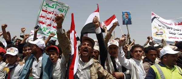 Yemenis shout slogans and wave national flags as they take part in celebrations marking the 26th anniversary of Yemen's 1990 reunification in the capital Sanaa on May 22, 2016 Yemenis shout slogans and wave national flags as they take part in celebrations marking the 26th anniversary of Yemen's 1990 reunification in the capital Sanaa on May 22, 2016 - Sputnik International