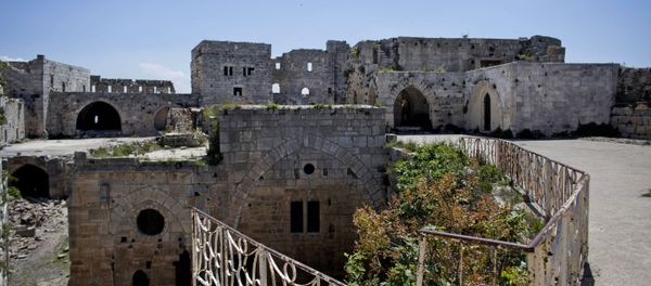 Crac des Chevaliers, the world's best preserved medieval Crusader castle, above the destroyed Sunni village of Hosn in Syria. Crac des Chevaliers, the world's best preserved medieval Crusader castle, above the destroyed Sunni village of Hosn in Syria. - Sputnik International