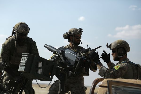 Men in uniform identified by Syrian Democratic forces as US special operations forces as they ride in the back of a pickup truck in the village of Fatisah in the northern Syrian province of Raqa. (File) Men in uniform identified by Syrian Democratic forces as US special operations forces as they ride in the back of a pickup truck in the village of Fatisah in the northern Syrian province of Raqa. (File) - Sputnik International