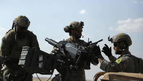Men in uniform identified by Syrian Democratic forces as US special operations forces as they ride in the back of a pickup truck in the village of Fatisah in the northern Syrian province of Raqa. (File) Men in uniform identified by Syrian Democratic forces as US special operations forces as they ride in the back of a pickup truck in the village of Fatisah in the northern Syrian province of Raqa. (File) - Sputnik International