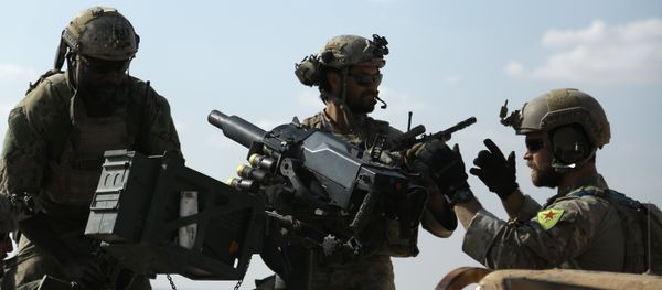 Men in uniform identified by Syrian Democratic forces as US special operations forces as they ride in the back of a pickup truck in the village of Fatisah in the northern Syrian province of Raqa. (File) Men in uniform identified by Syrian Democratic forces as US special operations forces as they ride in the back of a pickup truck in the village of Fatisah in the northern Syrian province of Raqa. (File) - Sputnik International