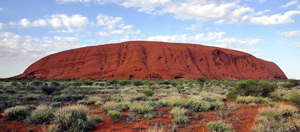 The monolith of Uluru (Ayers Rock) rises 340 metres above the ochre plain in the World Hertage-listed Uluru-Kata Tjuta National Park encompassing 1,325 square kms of desert in Central Australia The monolith of Uluru (Ayers Rock) rises 340 metres above the ochre plain in the World Hertage-listed Uluru-Kata Tjuta National Park encompassing 1,325 square kms of desert in Central Australia - Sputnik International
