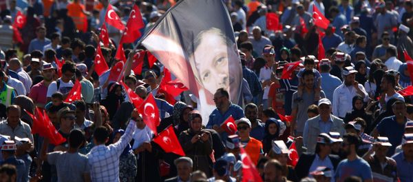 A man waves a flag with the image of Turkish President Tayyip Erdogan during a rally to mark the 563rd anniversary of the conquest of the city by Ottoman Turks, in Istanbul, Turkey, May 29, 2016. A man waves a flag with the image of Turkish President Tayyip Erdogan during a rally to mark the 563rd anniversary of the conquest of the city by Ottoman Turks, in Istanbul, Turkey, May 29, 2016. - Sputnik International