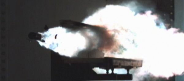 Particle debris ignites as a test slug exits the Office of Naval Research (ONR) 32 MJ (megajoules) Electromagnetic Railgun (EMRG) laboratory launcher located at the Naval Surface Warfare Center Dahlgren Division (NSWCDD) Particle debris ignites as a test slug exits the Office of Naval Research (ONR) 32 MJ (megajoules) Electromagnetic Railgun (EMRG) laboratory launcher located at the Naval Surface Warfare Center Dahlgren Division (NSWCDD) - Sputnik International